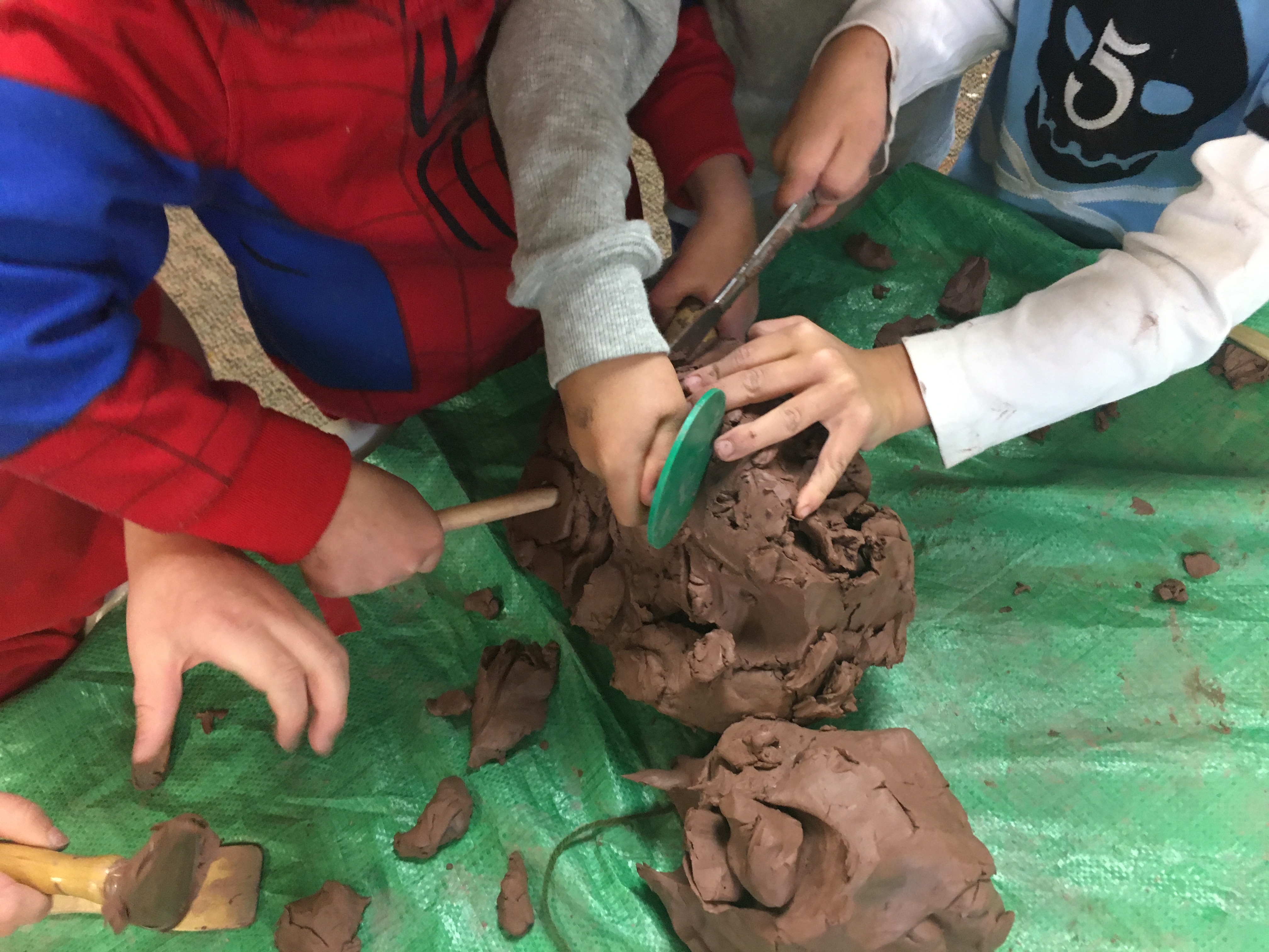 Kids hands in clay