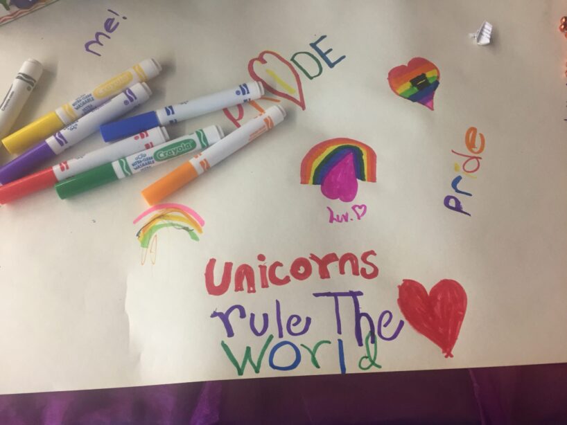 A picture of children's drawings including the phrase "unicorns rule the world"